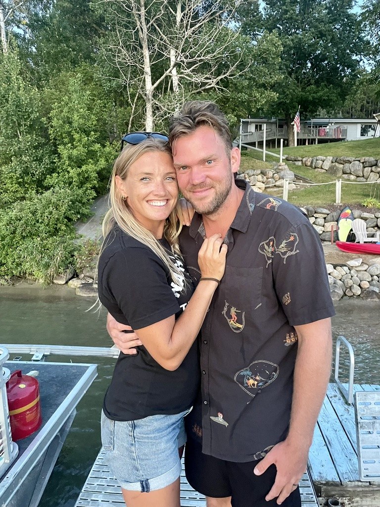 Trae and Christi together outdoors by the water