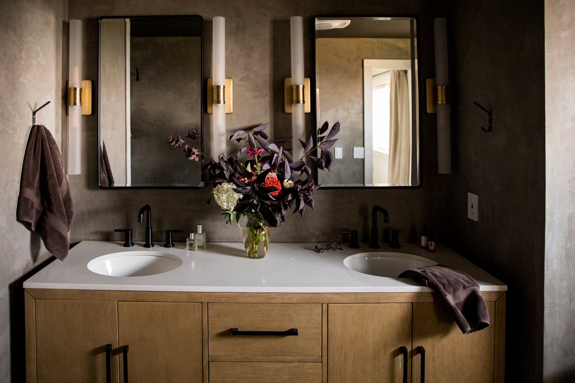 Bathroom vanity with warm wood and modern fixtures