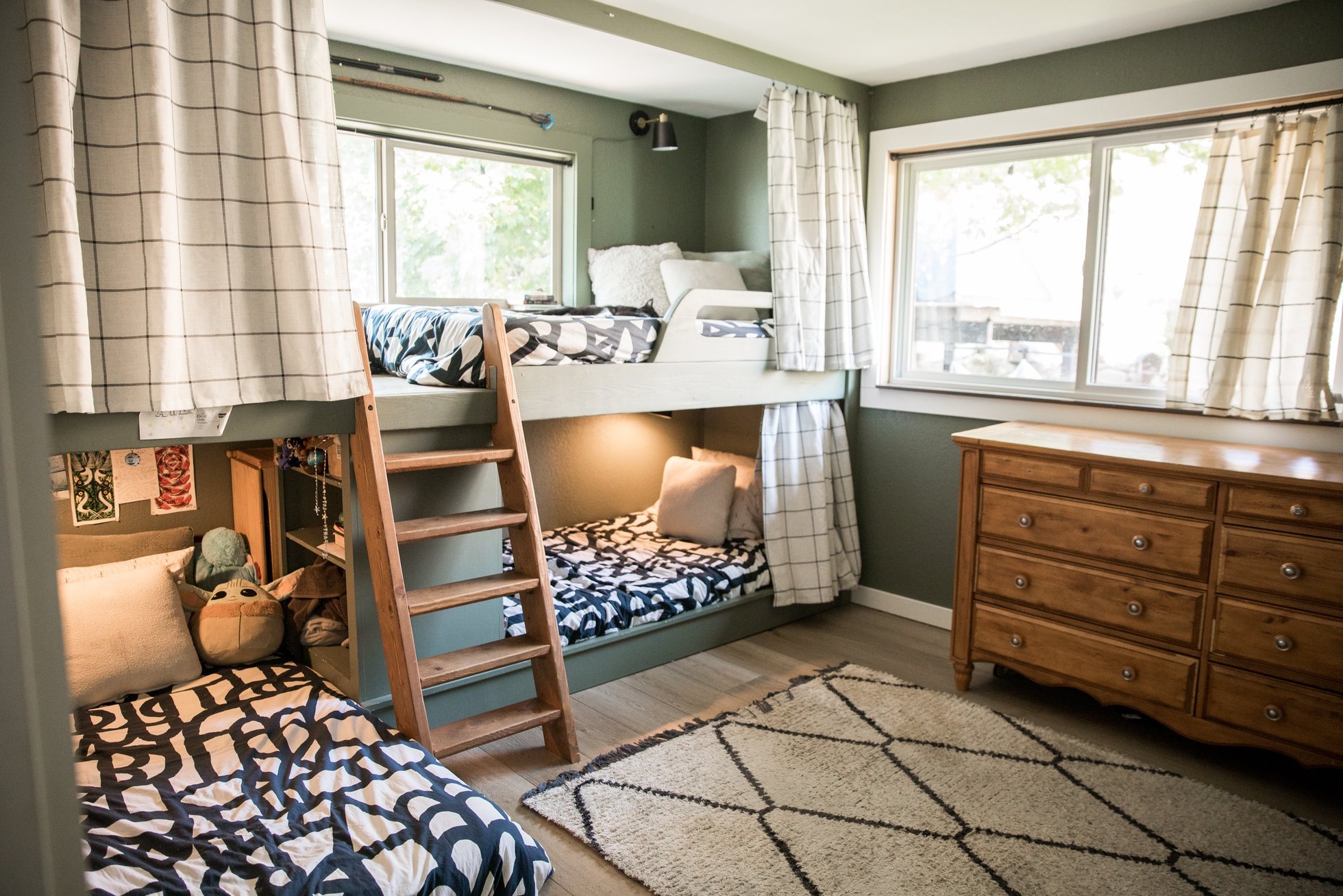 Children’s room with bunk beds and curtains