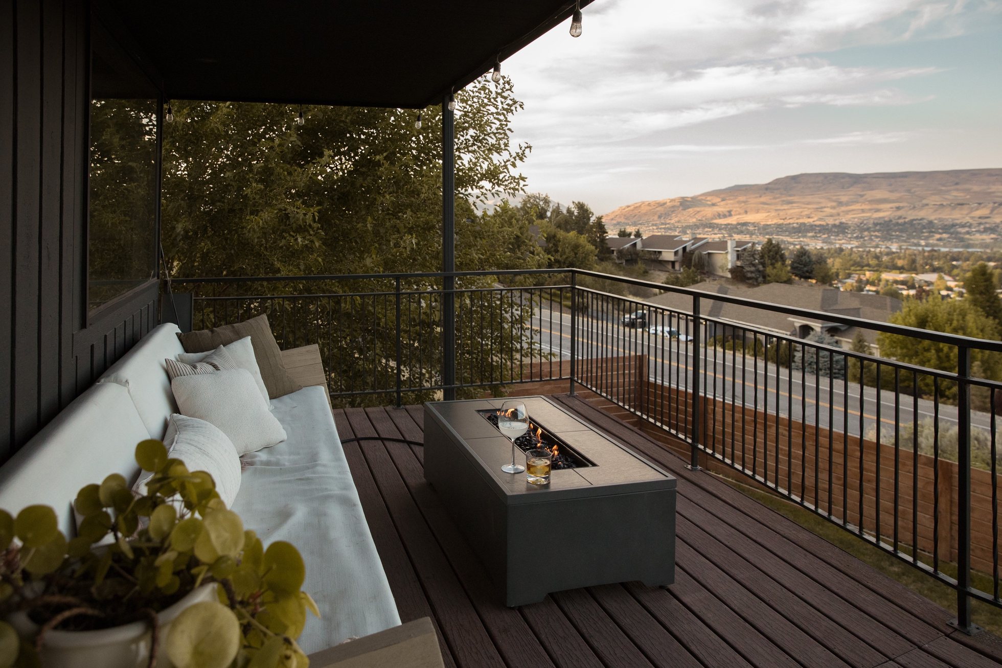 Inviting deck seating with a fire table overlooking the valley
