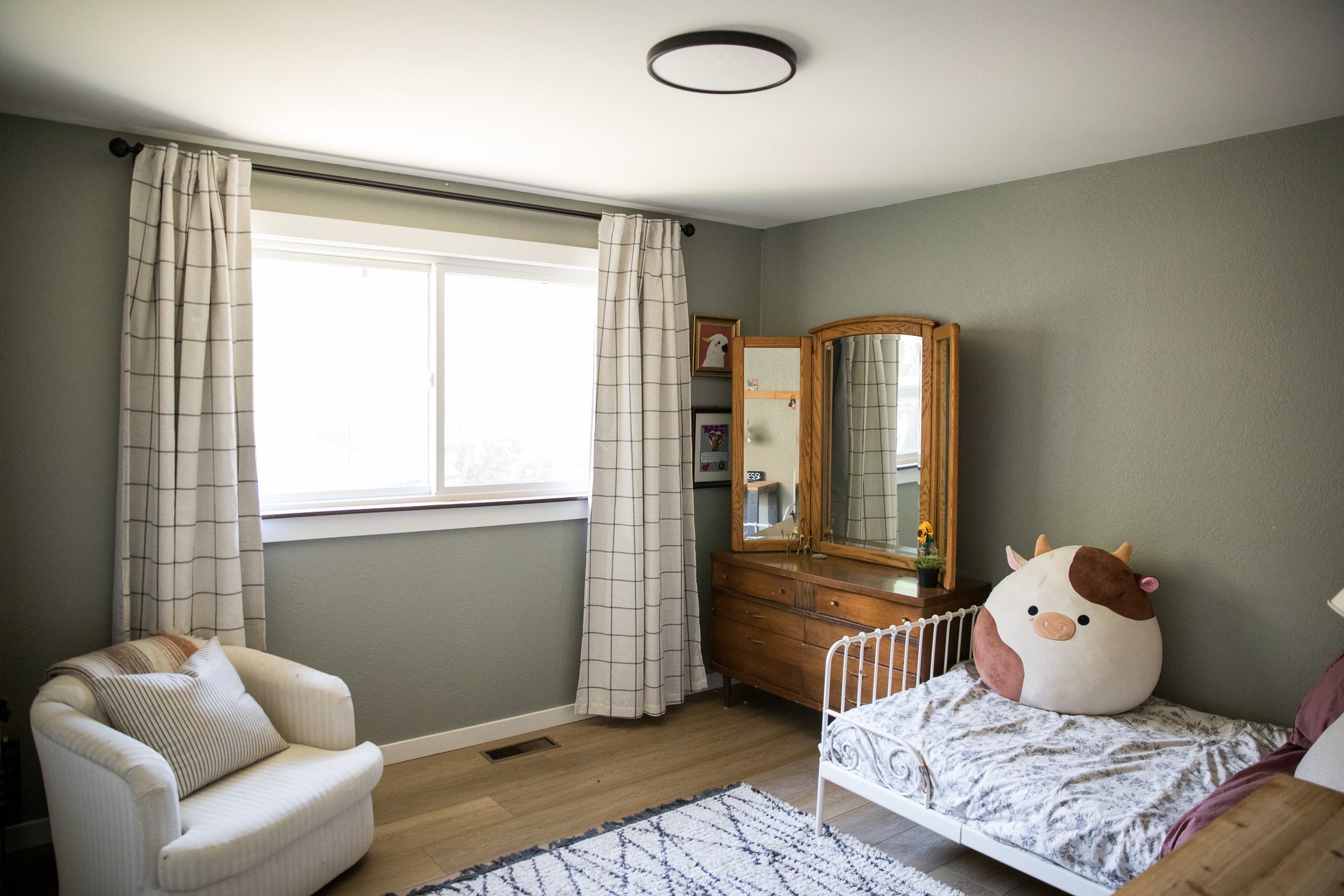 Bright bedroom with a twin bed and reading chair