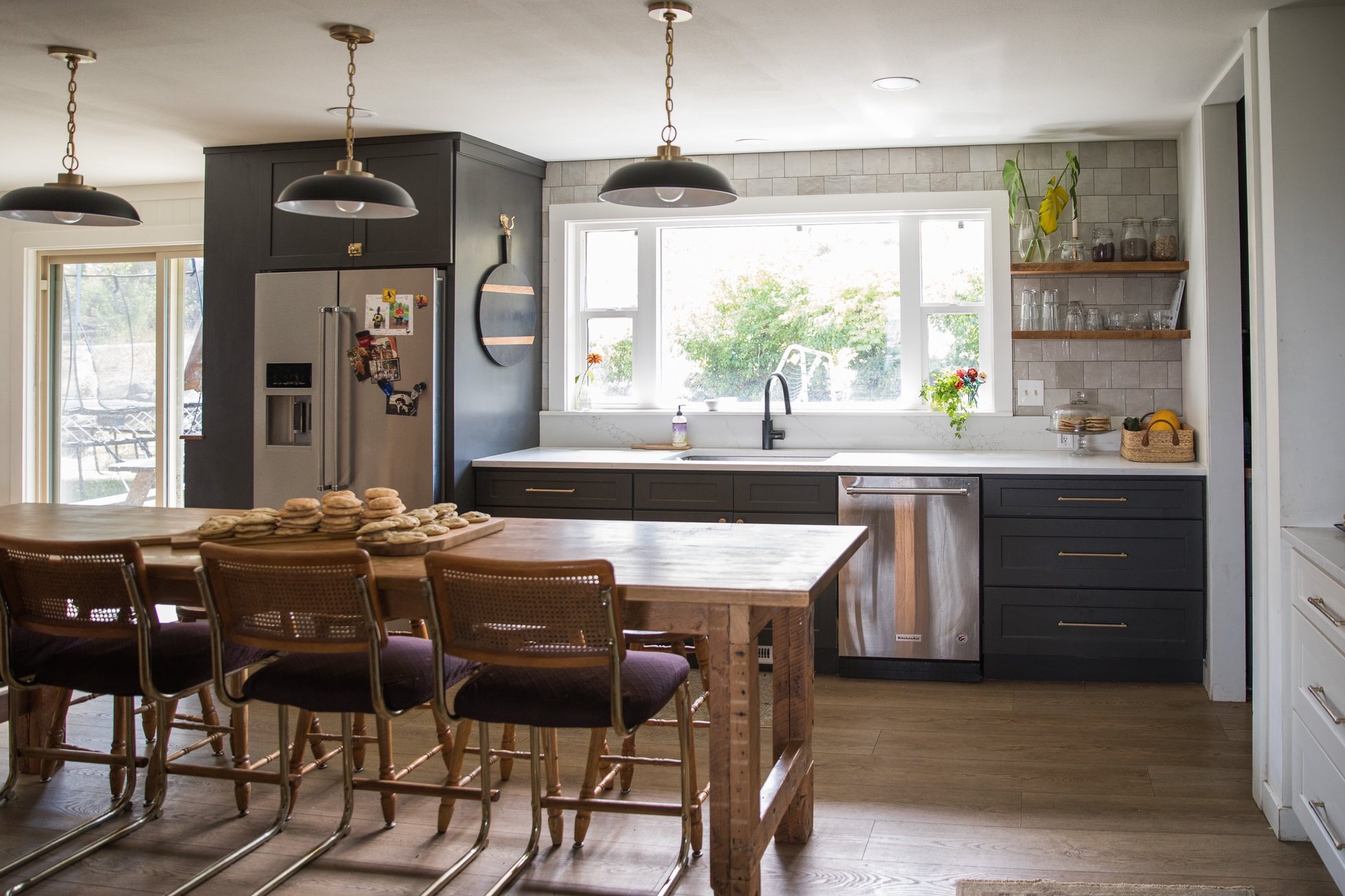 Light-filled kitchen with wooden dining table