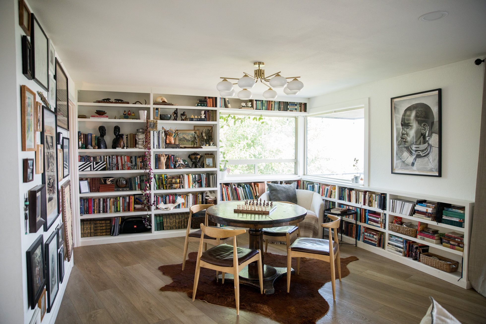 Light filled reading nook with floor-to-ceiling bookshelves